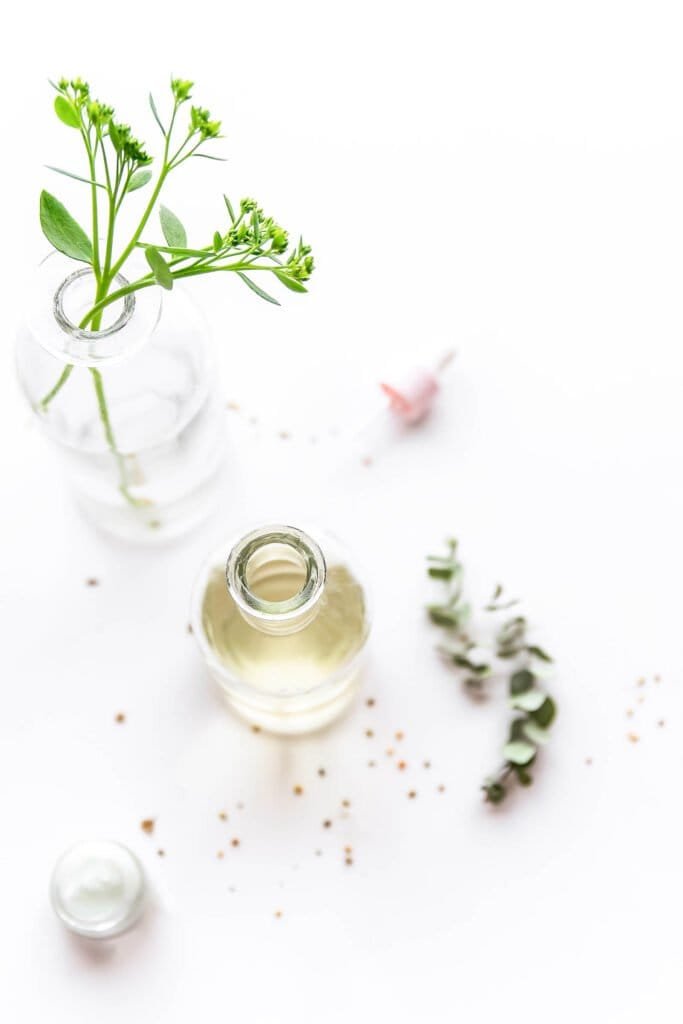 Fresh herbs and natural botanical oils for DIY scalp serum - ingredients for natural dandruff routine treatments