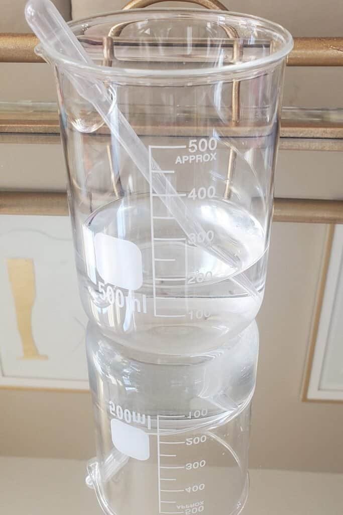 Pure aloe vera juice in glass beakers - base ingredient for DIY conditioning and nourishing dandruff treatment
