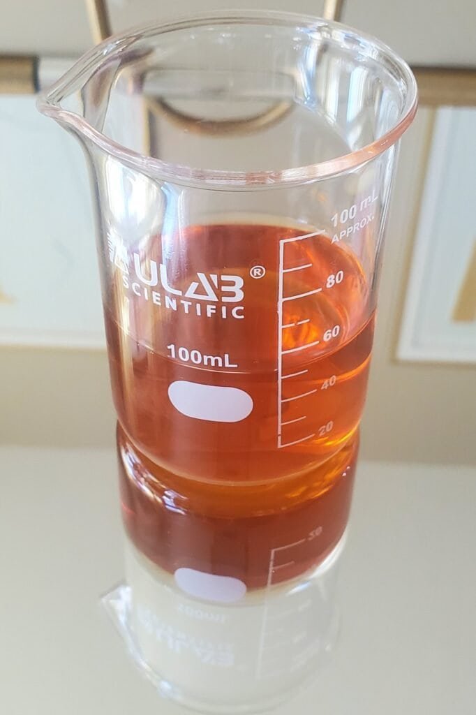 Finished DIY conditioning and nourishing treatment in glass beaker - combined shikakai, apple cider vinegar, and aloe vera dandruff remedy