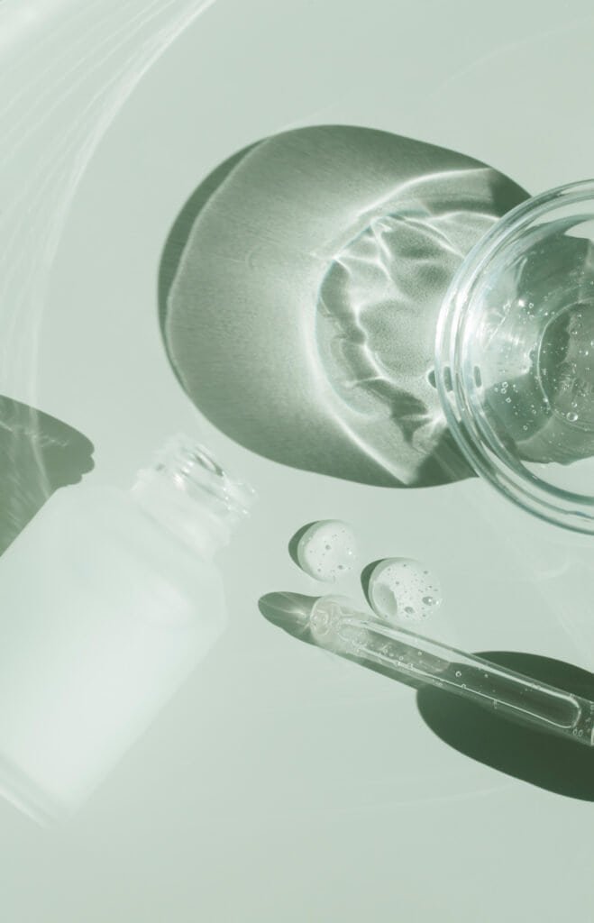 Natural scalp treatment preparation showing water and glass containers for creating DIY dandruff remedies using the 5-pillar approach