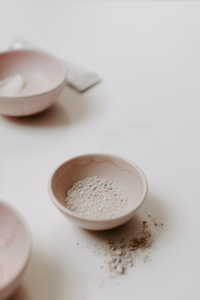 Raw natural ingredient powder showcasing barrier-supporting and soothing compounds for scalp wellness products