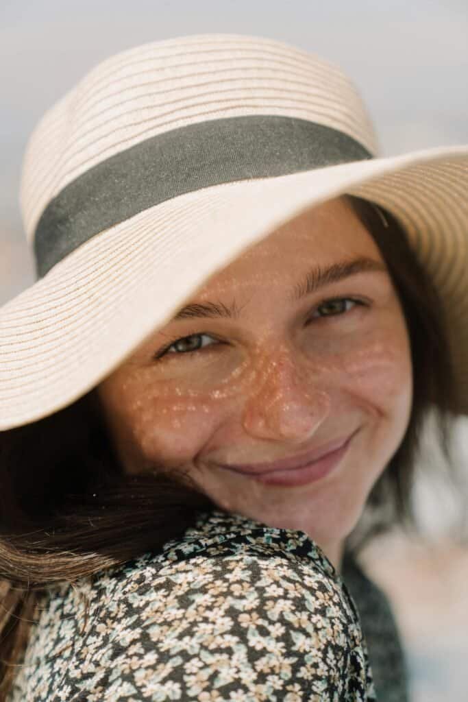 Bright orange sea buckthorn berries clustered on a branch with silver-green leaves, the carotenoid-rich plant source of sea buckthorn oil used for natural sunburn relief and UV-damaged skin repair